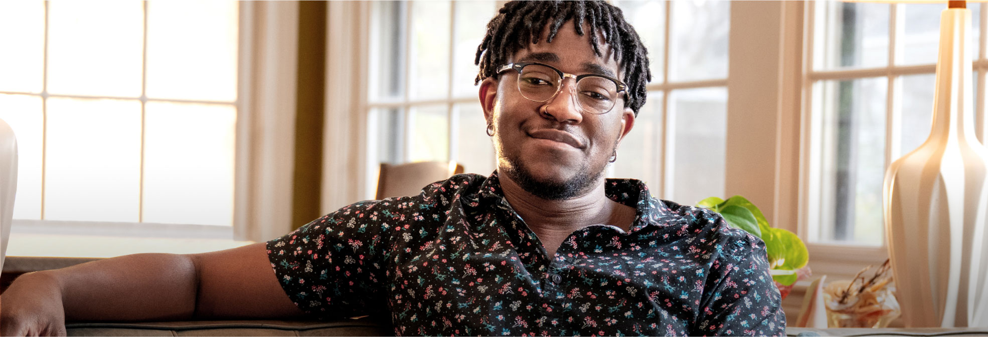 Man sitting indoors on a couch