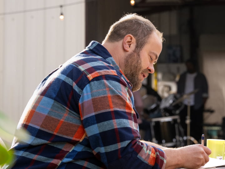 Man sitting and writing